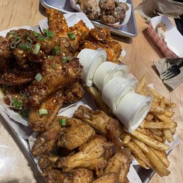 40 Chicken wings plus seasoned fries. Flavors ; Fire wing, Garlic Parmesan, Louisiana Rub and Saigon street 40 Chicken wings plus seasoned fries. Flavors ; Fire wing, Garlic Parmesan, Louisiana Rub and Saigon street