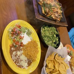 Chicken fajitas for 2, the side plate it comes with (we each got one), guacamole with 2 avocados (maybe too much for 2 people) & chips Chicken fajitas for 2, the side plate it comes with (we each got one), guacamole with 2 avocados (maybe too much for 2 people) & chips