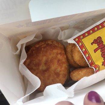 Bojangles - a person holding a box of food - Fast Food Near Me - Lebanon, Tennessee