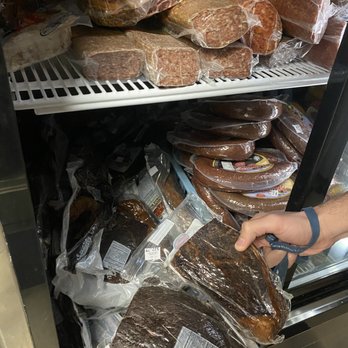 Europa Delicatessen - a person reaching for a bag of meat - Delis Near Me - Erie, Pennsylvania Europa Delicatessen - a person reaching for a bag of meat - Delis Near Me - Erie, Pennsylvania