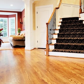 Taylor Made Wood Flooring - a living room and staircase - Flooring Near Me - New Braunfels, Texas Taylor Made Wood Flooring - a living room and staircase - Flooring Near Me - New Braunfels, Texas