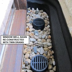 Epoxy Injection Specialists - Basement window well basin with twin drains.