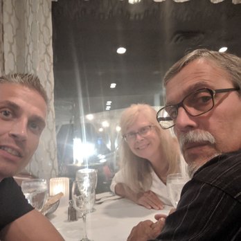 Carlucci's Waterfront - Myself, Mother, and Father, seated in the inside dining room Carlucci's Waterfront. - Seafood Near Me - Mount Laurel, New Jersey