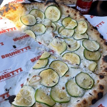 Brunetti Pizza Westhampton Beach - Pizza topped with fresh, local zucchini, garlic, and burrata - Italian Near Me - Westhampton Beach, New York Brunetti Pizza Westhampton Beach - Pizza topped with fresh, local zucchini, garlic, and burrata - Italian Near Me - Westhampton Beach, New York