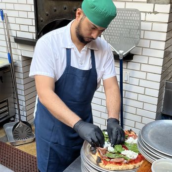 Emporio - Dressing the pizza - Italian Near Me - New York, New York Emporio - Dressing the pizza - Italian Near Me - New York, New York