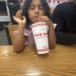 My daughter enjoying her drink My daughter enjoying her drink