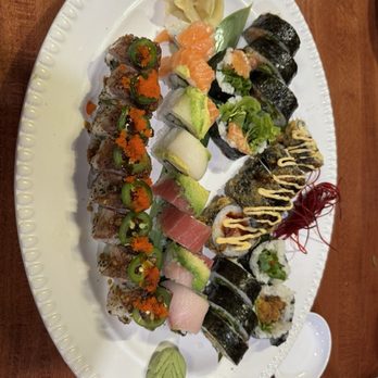 Hasu Japanese Restaurant - The roll in the back middle with the spicy mayo drizzle was the Marc's roll. To the right is the spider roll, and left was salmon roll - Sushi Bars Near Me - Hastings, Minnesota
