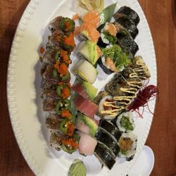The roll in the back middle with the spicy mayo drizzle was the Marc's roll. To the right is the spider roll, and left was salmon roll