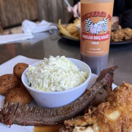 Beef brisket small plate with classic slaw and hush puppies (shared a chicken tender with my son!) Beef brisket small plate with classic slaw and hush puppies (shared a chicken tender with my son!)