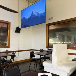 La Lechonera - Seating with TVs