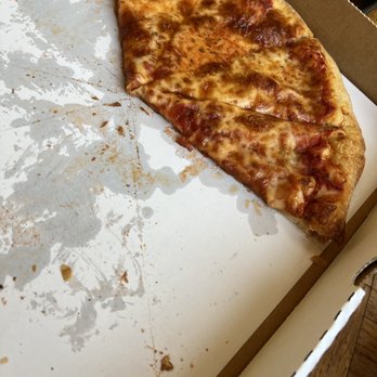 DeMarco's Pizza - a half eaten pizza in a box - Pizza Near Me - Dearborn, Michigan DeMarco's Pizza - a half eaten pizza in a box - Pizza Near Me - Dearborn, Michigan