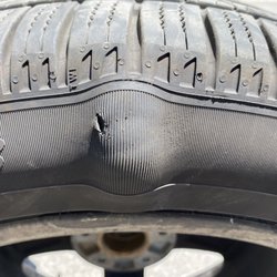 Chevron - Tire bulge on the inside of the tire seen by the technician at pull in, while there for a smoke out of engine issue!