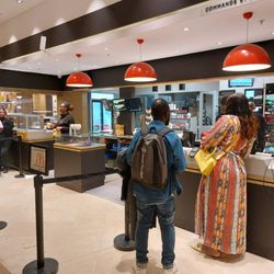 McDonald's - McDonald's (Worst McDonald's manager ever in the background with the black vest and bald head to the right of the woman)