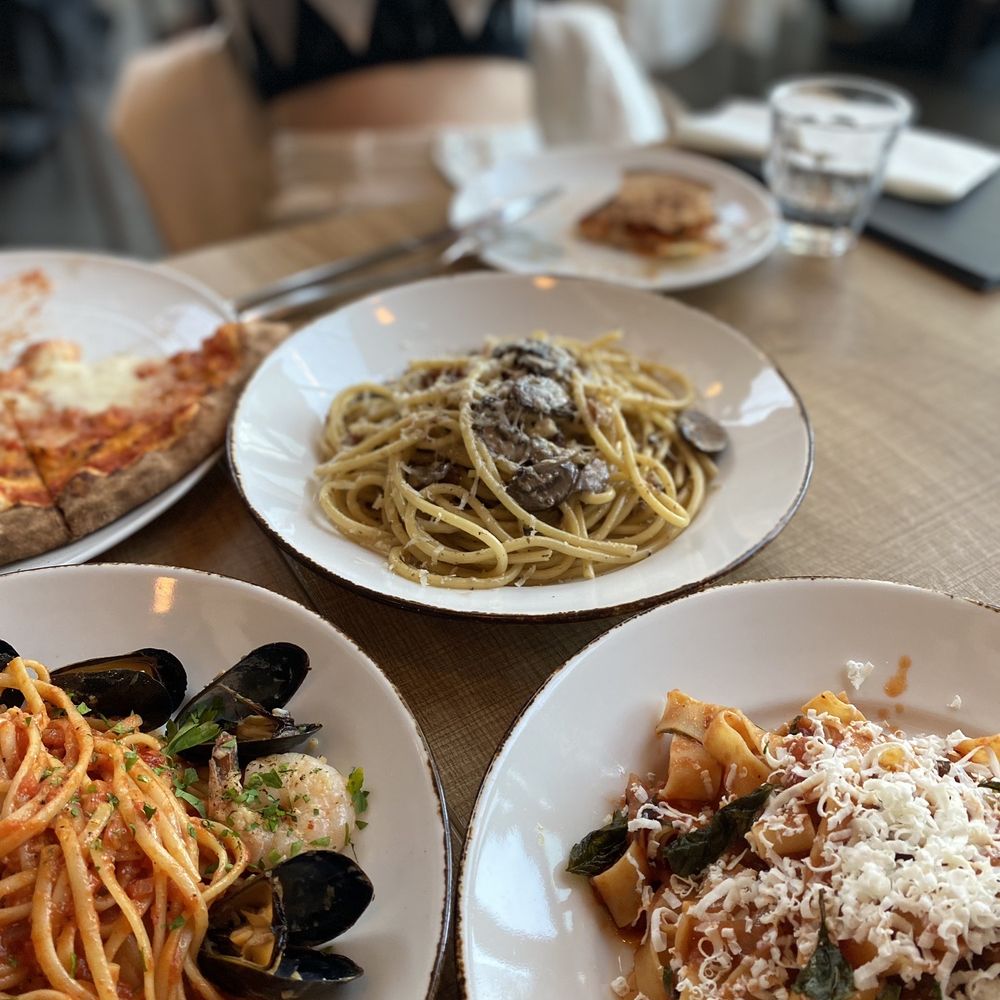 Claudio's - three plates of pasta and a pizza - Italian Near Me - Burnaby, British Columbia