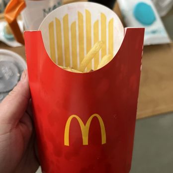 McDonalds - a hand holding a french fries - Fast Food Near Me - Bakersfield, California