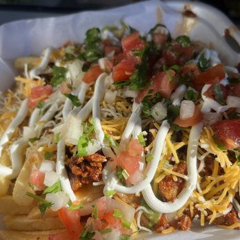 Chofis Tacos - a variety of toppings in a styrofoam container - Food Trucks Near Me - Tulare, California