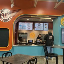 Exterior outside entrance of Woodie's Wings - storefront - Oswego, Illinois Exterior outside entrance of Woodie's Wings - storefront - Oswego, Illinois