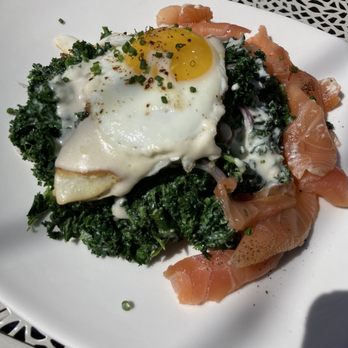 The Downing Bottles & Bites - Kale salad with salmon - Wine Bars Near Me - Rockwall, Texas