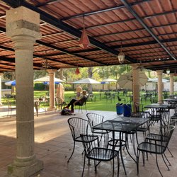 La Gruta - Lots of places to sit in the sun or shade, on concrete or grass, beside a pool or not