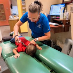 Dr Strouff adjusting my 1 year old!