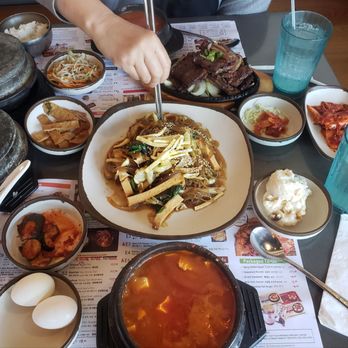 BCD Tofu House - Kalbi beef plate (top) Japchae (center) Beef Tofu Soup (bottom) Sides all around - Korean Near Me - Irvine, California
