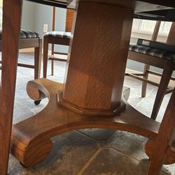 American Furniture Exchange - Pedestal of oak table with 3 feet on wheels for easy movement