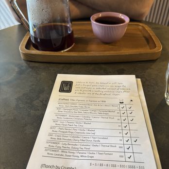 NoFi - Menu with an order of DAK - Cream Donut / Colombia on the table - Coffee & Tea Near Me - San Antonio, Texas NoFi - Menu with an order of DAK - Cream Donut / Colombia on the table - Coffee & Tea Near Me - San Antonio, Texas
