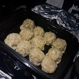 Chicken Momo w a spicy sauce Chicken Momo w a spicy sauce