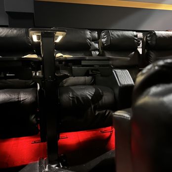 Flix Brewhouse - Des Moines - a row of black leather recliners - Breweries Near Me - Des Moines, Iowa