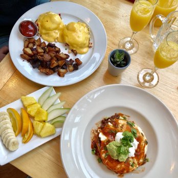 Jack Sprat - Crab eggs Benedict ($20) huevos rancheros ($13.50) seasonal fruit plate ($5) and a pitcher full of mimosas ($30) - New American Near Me - Girdwood, Alaska