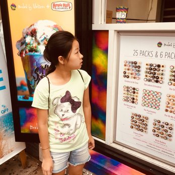 Baked by Melissa - a little girl standing in front of a poster - Cupcakes Near Me - New York, New York Baked by Melissa - a little girl standing in front of a poster - Cupcakes Near Me - New York, New York