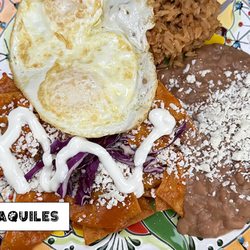 Señor Chilaquiles - Red ChilaquilesOur red chilaquiles are a fiery delight, with crispy tortilla chips drenched in rich, smoky red sauce, topped with crumbled