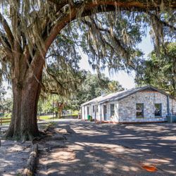 Leon's at Lake Ella - Our restaurant is a small, historic, lakeside cottage! We have seating inside and outside!