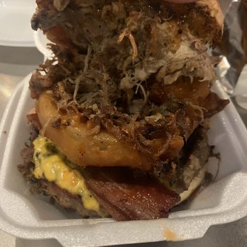 Phil's BBQ - Philibuster Burger with 1/2lb patty with cheese hand battered onion ring with honey bacon and broham aka pulled pork. On a fresh Baked Bun. - Barbeque Near Me - Temecula, California