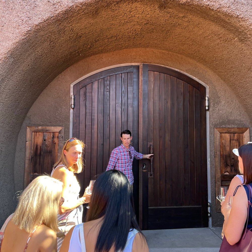 Joseph Cellars Winery - Our host opening the doors to the wine cave - Wine Tours Near Me - Calistoga, California Joseph Cellars Winery - Our host opening the doors to the wine cave - Wine Tours Near Me - Calistoga, California