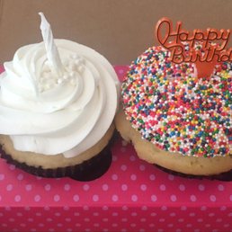 Almond Cupcake with Candle and Birthday Cake Cupcake with the Happy Birthday Sign.