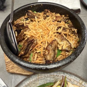 August Gatherings - Baked Oyster and Black Garlic with Rice in Stone Pot - Cantonese Near Me - New York, New York