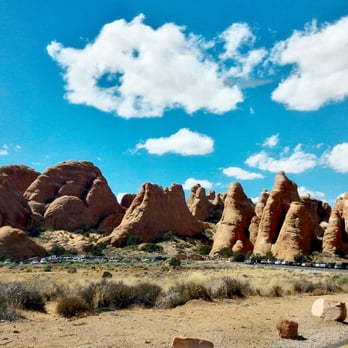 Arches National Park - Parking for the Devils Garden trailhead. Look how small the cars are! - Parks Near Me