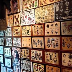 111 Arts Gallery & Tattoo Studio - A metric TON of cool old tattoo flash. If you can't find something that speaks to you in here, you don't want a tattoo.