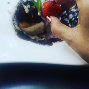 Chez Joel Bistro - Lush strawberry placed atop my dessert - French Near Me - Chicago, Illinois