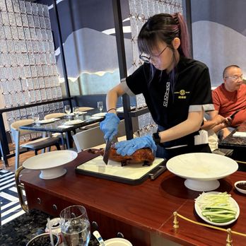 Spring by China Mama - Michelle carving our duck. - Chinese Near Me - Las Vegas, Nevada