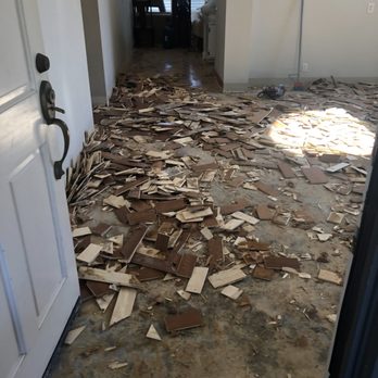 West Coast Flooring Center - a room with a lot of debris on the floor - Flooring Near Me - Capistrano Beach, California West Coast Flooring Center - a room with a lot of debris on the floor - Flooring Near Me - Capistrano Beach, California