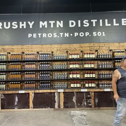 a man standing in front of the store a man standing in front of the store