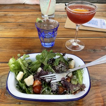 Garbo’s - Side salad with the daiquiri Monarca. Excellent! My favorite salad dressing ever! - Seafood Near Me - Austin, Texas