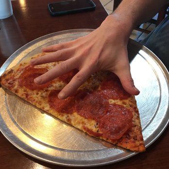 Pazzo! Big Slice Pizza - This is the slice with my husband's 10 in span from pinky to thumb! - Italian Near Me - Hoover, Alabama Pazzo! Big Slice Pizza - This is the slice with my husband's 10 in span from pinky to thumb! - Italian Near Me - Hoover, Alabama