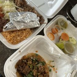 Carnitas with rice, bean, tortillas (in the foil) and salad (their version: lettuce and tomatoes), then 2 carne asada tacos (I ate one).