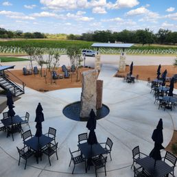 a patio with tables and umbrellas a patio with tables and umbrellas