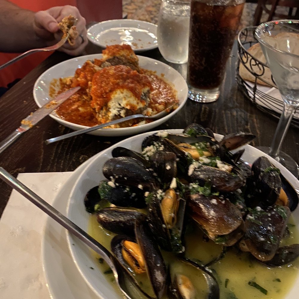 Tony D's - Mussels in a scrumptious broth in the front and giant meatballs and ricotta in the back. - Pizza Near Me - Rochester, New York Tony D's - Mussels in a scrumptious broth in the front and giant meatballs and ricotta in the back. - Pizza Near Me - Rochester, New York