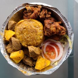 Mofongo with beef stew and fried chicken