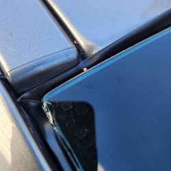 Progressive Auto Insurance - Terrible installation and glass chipped at the corner.  Looks like a used back windshield was installed.